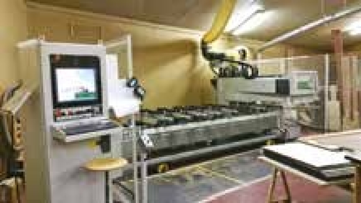 Machine à commande numérique Biesse Rover A acquise en 2009.